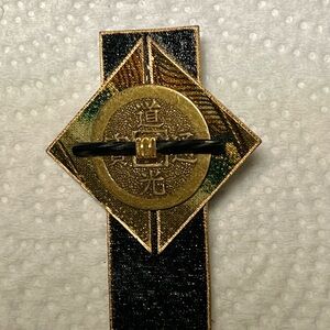 Paper mache asian motif lapel brooch,round coin/black glass tube with brass.